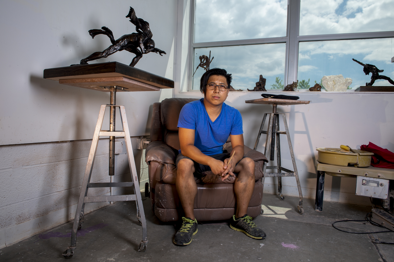 Artist Kiet Le poses in his studio.